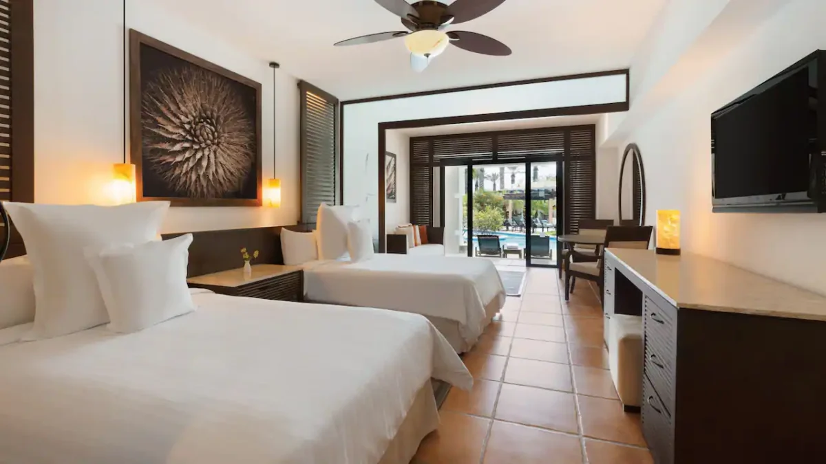 Club Swim-Up Master Double suite with two double beds and direct pool access at Hyatt Ziva Los Cabos.