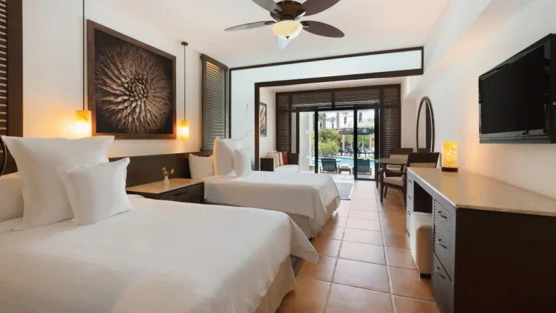 Club Swim-Up Master Double suite with two double beds and direct pool access at Hyatt Ziva Los Cabos.