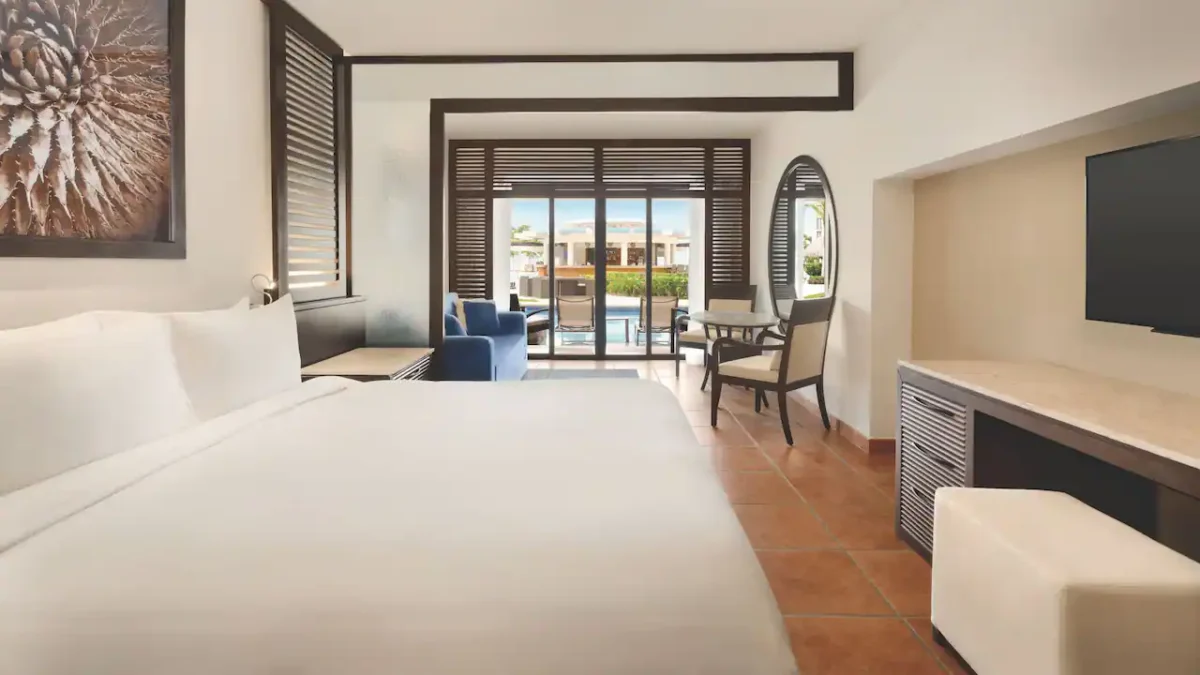 Club Swim-Up Master King suite with king bed and direct pool access at Hyatt Ziva Los Cabos.