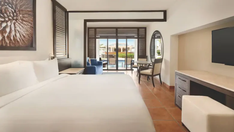 Club Swim-Up Master King suite with king bed and direct pool access at Hyatt Ziva Los Cabos.