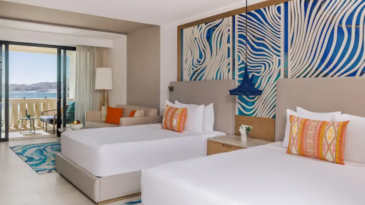Deluxe Ocean View Double room with two double beds, sleeper sofa, private terrace, and partial Sea of Cortez views at Hyatt Ziva Los Cabos.