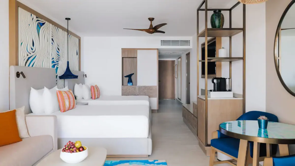 Deluxe Resort View Double room with two double beds, sleeper sofa, and furnished terrace at Hyatt Ziva Los Cabos.
