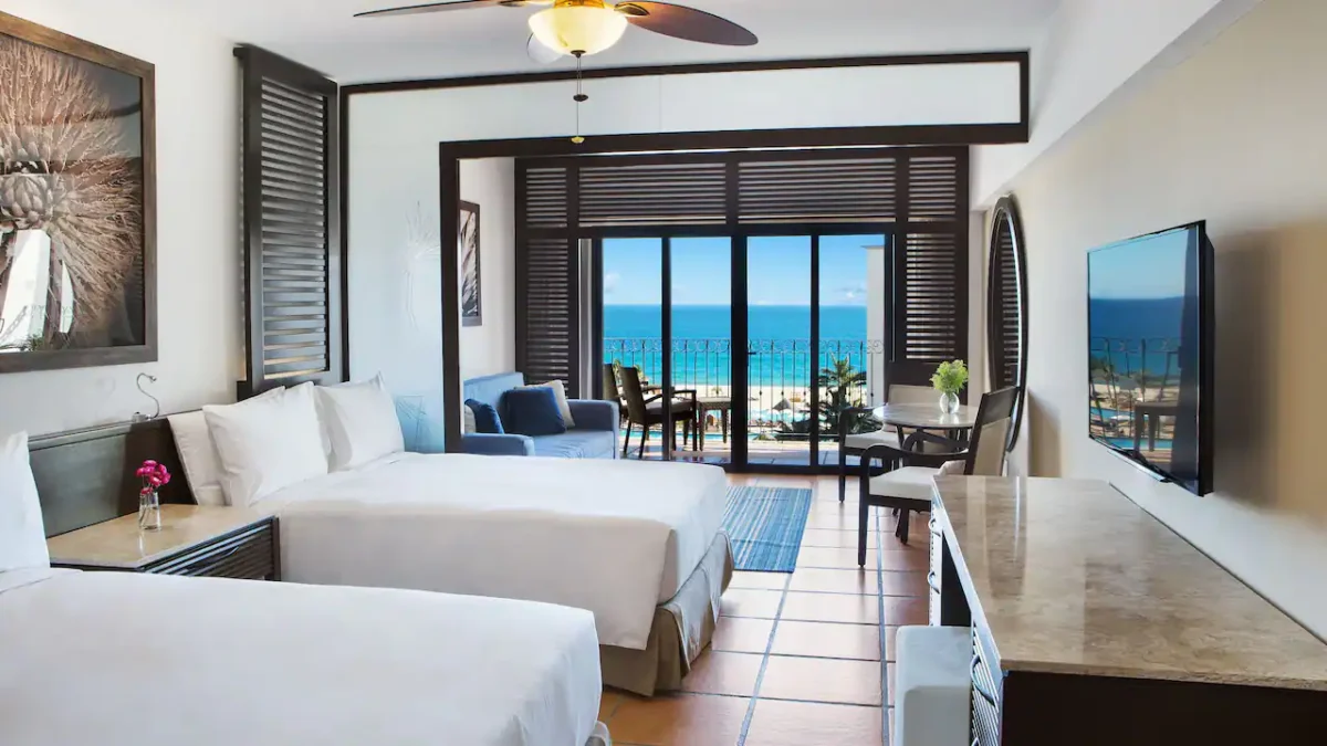 Ocean View Master Double room with two double beds, sleeper sofa, private terrace, and partial Sea of Cortez views at Hyatt Ziva Los Cabos.